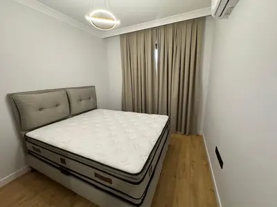 a small bedroom with a bed in a room at Kervansaray Comfort in Ayii Trimithias