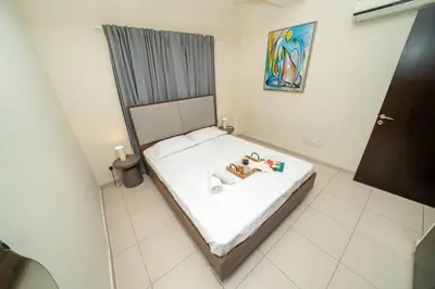 a small bedroom with a bed in a room at 2 bedroom flat in Nicosia