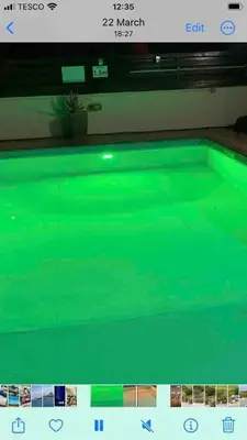 a swimming pool with avertisement for avertisementosateosateosateosateosateosateosate at MANDARIN Villa in Paralimni