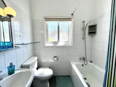 a white bathroom with a toilet and a sink at STAY ALKYONI Villa in Protaras