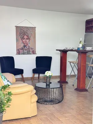 a living room with a couch and a table at Gold Feather 2Bedroom Center Location and Pool in Ayia Napa