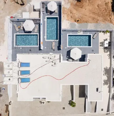 an overhead view of a building with two swimming pools at PANATHEON - Luxury 1 & 2 bdr bungalows 300 meters from sandy beach! in Ayia Napa