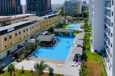 an overhead view of a swimming pool in a city at Caesar Resort Apartments Marcellus 51 in Iskele