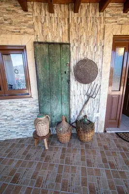 a room with three baskets on the side of a building at Archontikon 1817 in Kaliana