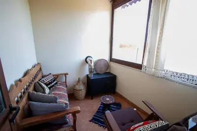 a living room with a couch and a window at Archontikon 1817 in Kaliana