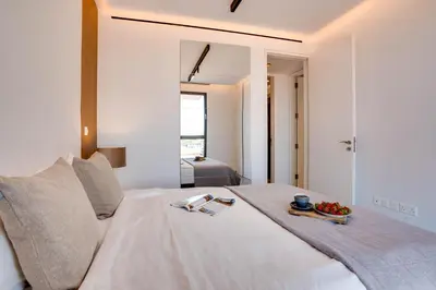 a bedroom with a bed with a tray of fruit on it at Sea View Central Deluxe GAIA 302 in Larnaka