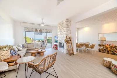 a living room with a couch and a table at Ayia Thekla Beach House in Ayia Napa