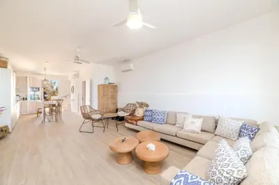 a living room with a couch and a table at Ayia Thekla Beach House in Ayia Napa