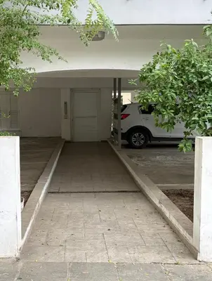 an empty parking lot with a car parked in it at Cozy Central Stay with City Views in Nicosia