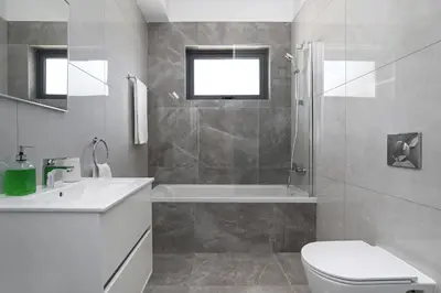 a bathroom with a toilet and a tub and a sink at Villa Violeta - 3bed Bungalow large pool in Protaras