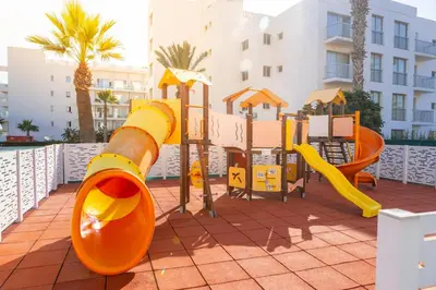a playground at a resort with a slide at Papantonia Hotel in Protaras