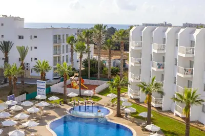an aerial view of a resort with a pool and buildings at Papantonia Hotel in Protaras