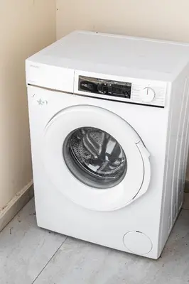 a white washer and dryer in a room at Aeolis Court Apartment by Ezoria Villas in Limassol