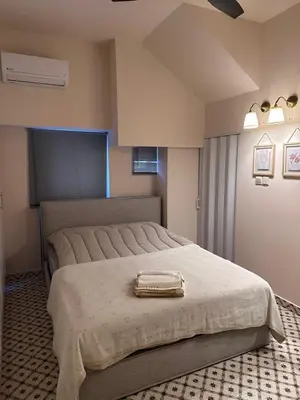 a bedroom with a large bed with a tray on it at Mavrommati Luxury Residence no1 in Limassol