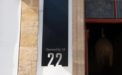 a sign in the window of a building with at 22 Yedia North Nicosia Turkish Side in Nicosia