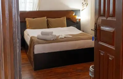 a bedroom with a bed with two towels on it at 22 Yedia North Nicosia Turkish Side in Nicosia
