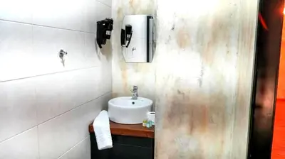 a bathroom with a sink and a soap dispenser at 22 Yedia North Nicosia Turkish Side in Nicosia