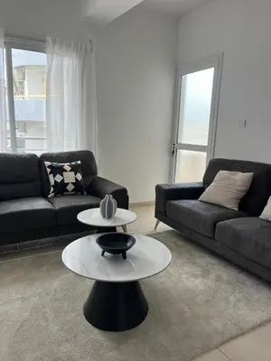 a living room with a couch and a table at The Catherine in Larnaka