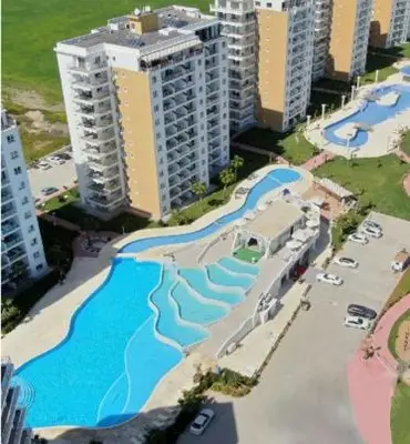 an aerial view of a river in a city at CAESAR RESORT İSKELE Long Beach in Vrysoules