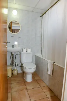 a bathroom with a toilet and a sink at Sweet Memories STANDARD Apts in Protaras