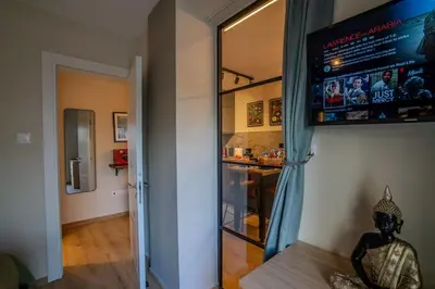 a television hanging on a wall in a room at Boutique & Brand New Prime Location Park & Beach in Limassol