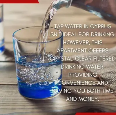 a glass of water being poured into it at Boutique & Brand New Prime Location Park & Beach in Limassol