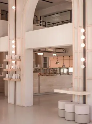 a large room with a table and a counter at kolektif suites in Kérynia