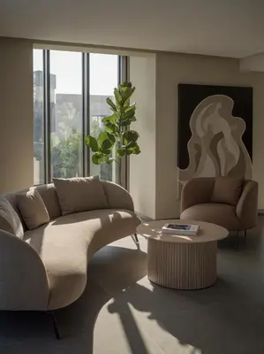 a living room with a couch and a table at kolektif suites in Kérynia