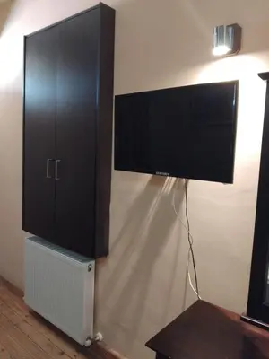 a flat screen tv hanging on a wall at PAOK Kakopetria in Aglantzia