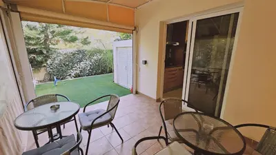 a room with a table and chairs and a patio at STAY Nissi House in Ayia Napa