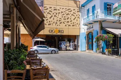 a car is driving down a street in a city at Le Bandit Studio in Larnaka