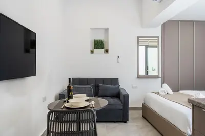 a living room with a couch and a table at Starlight Studio in Larnaka