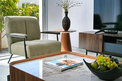 a living room with a coffee table with a bowl of fruit at Villa Brigita in Ayia Napa