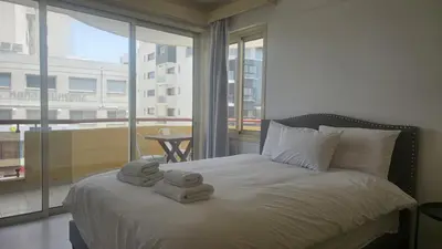 a bedroom with a bed with two towels on it at STAY Elion Apartment in Nicosia