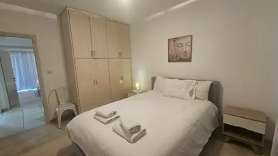 a bedroom with a bed with two towels on it at STAY Elion Apartment in Nicosia