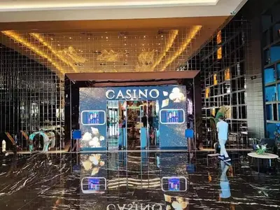 a casino store in a mall with a woman walking past it at Grand Sapphire Resort & Casino in Phikardhou