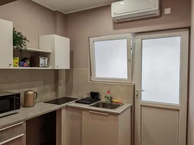 a small kitchen with a sink and a window at Studio in the center of Nicosia 3 in Nicosia