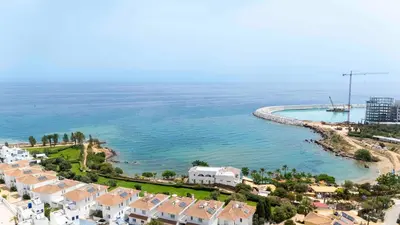 an aerial view of a beach with houses and the ocean at Sirena Solis Villa - Elegant 5-bedroom Sea View Retreat near Sirena Bay in Protaras