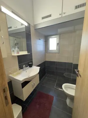 a bathroom with a sink and a toilet at 2 BR apartment in the Limassol with sea view in Limassol