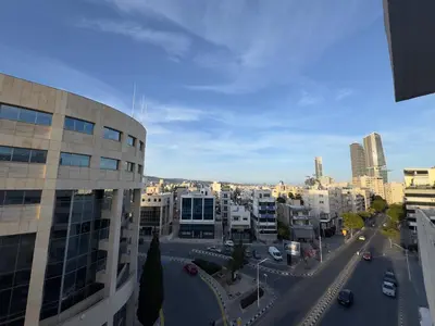 a view of a city with buildings and a street at 2 BR apartment in the Limassol with sea view in Limassol