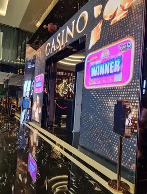 a casino winner sign on the wall of a store at Grand Sapphire Resort in Aglantzia