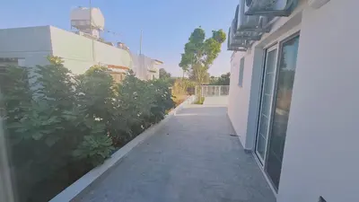 a sidewalk next to a building with plants on it at STAY The Getaway Apartment in Pyla