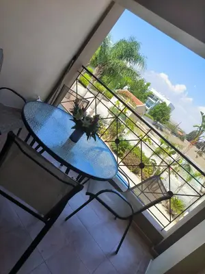a table and two chairs in a room with a window at 2 Bed Apartment in Kiti with Communal Pool in Kiti