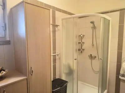 a shower with a glass door in a bathroom at 3 Bedroom Apartment Old Town Larnaca 5 minute walk to Finnikoudes Beach in Larnaka