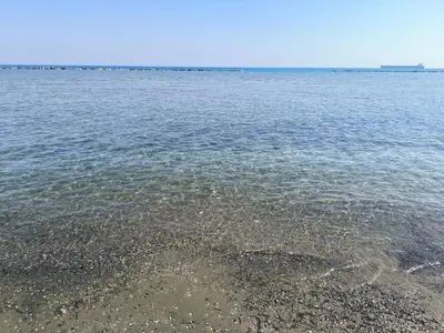 a large body of water with a rocky shore at 3 Bedroom Affordable Apartment in Oroklini with Communal Pool in Voroklini