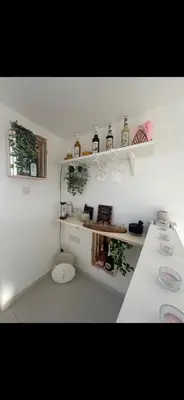 a white bathroom with a toilet in a room at MERAKI Villa in Paralimni