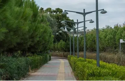 a walkway with street lights on the side of a road at RIVERA Studios 1 in Limassol