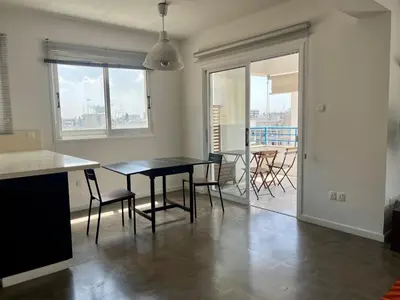 a kitchen and dining room with a table and chairs at The Comfort Stay in Nicosia Verenikis - Platform 357 in Nicosia