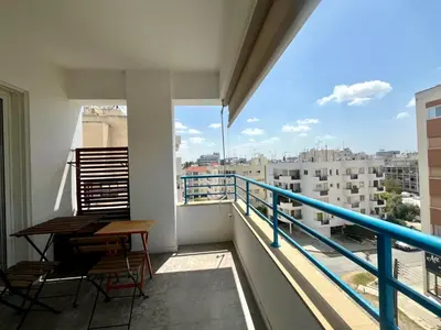 a balcony with a table and chairs and a view at The Comfort Stay in Nicosia Verenikis - Platform 357 in Nicosia