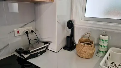 a kitchen counter with a phone and a toaster at STAY Azure Dream Apartment in Paralimni